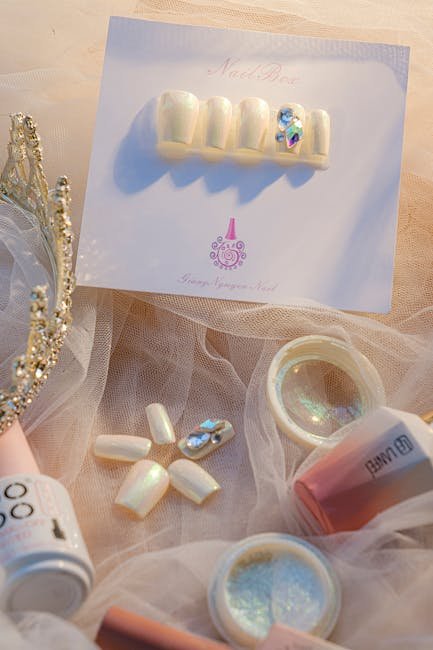 Sophisticated nail art set with a crown accessory, perfect for glamorous beauty styling.